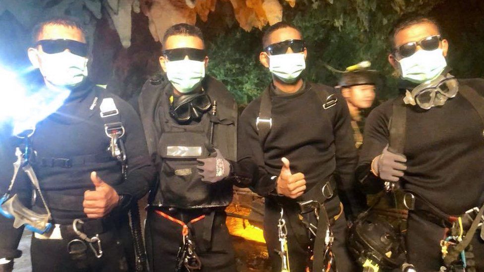 The three Royal Thai Navy SEAL divers and medics who stayed in the cave with the boys and coach since they were located on July 2. Officials said they emerged from the cave "healthy" shortly after the last rescues were made, July 10, 2018. Royal Thai Navy SEALs